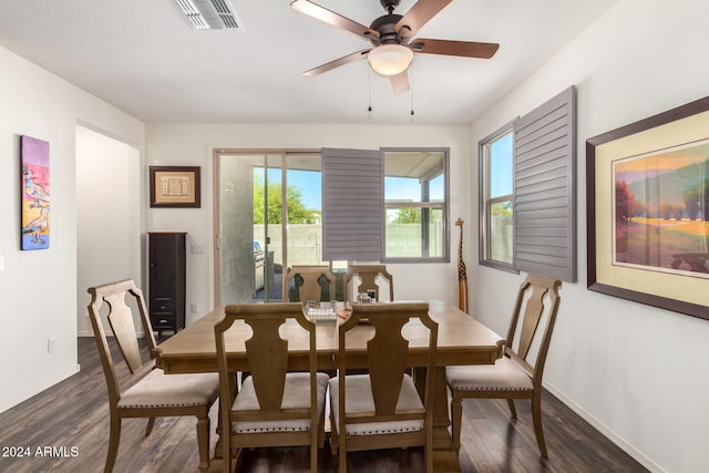 dining space featuring ceiling fan and dark hardwood / wood-style flooring