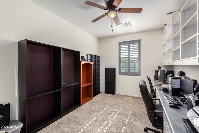 carpeted office with ceiling fan