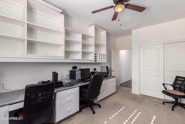 carpeted home office with ceiling fan