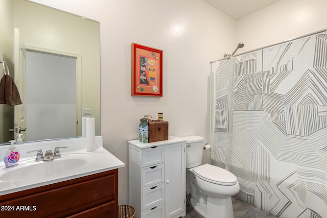 bathroom with vanity, toilet, and walk in shower