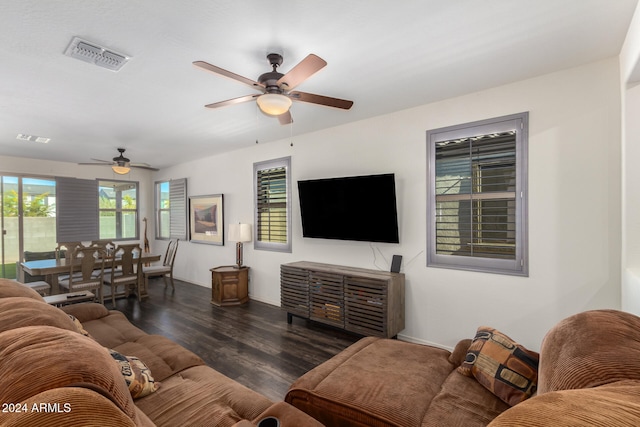 living room with ceiling fan and dark hardwood / wood-style floors