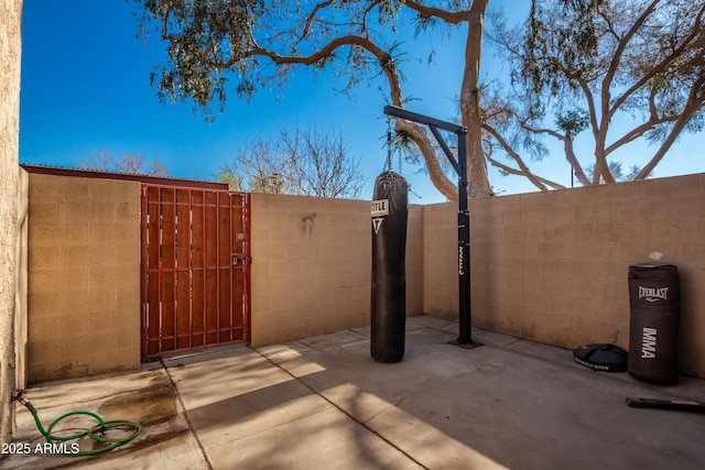 4240 N 67th Ln, Phoenix, AZ 85033 - view of patio / terrace featuring a gate and fence