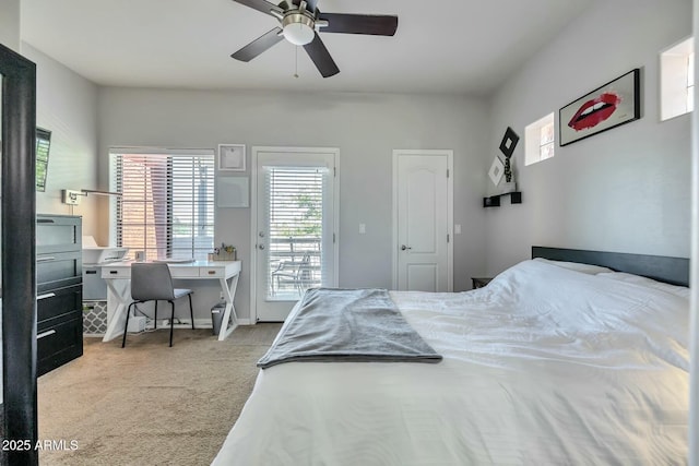 carpeted bedroom featuring access to outside, baseboards, and ceiling fan