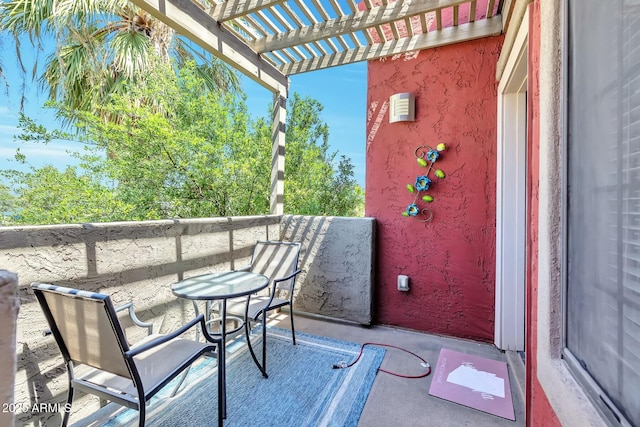 view of patio / terrace featuring a balcony and a pergola