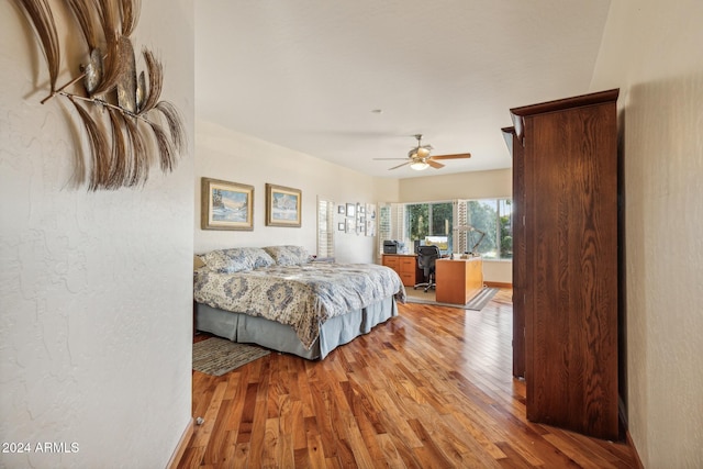 bedroom featuring ceiling fan and light hardwood / wood-style flooring