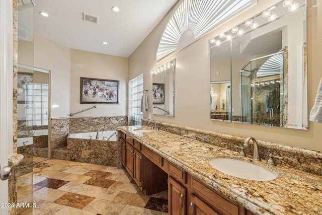 bathroom featuring vanity, shower with separate bathtub, and tile walls