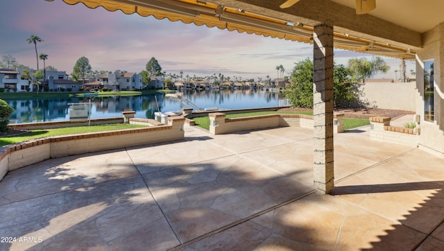 patio terrace at dusk with a water view