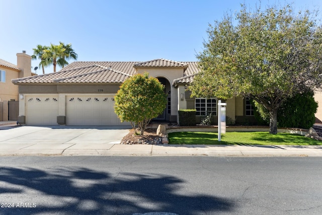 mediterranean / spanish-style house featuring a garage