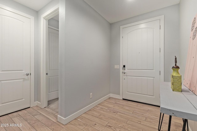 6931 W Spur Dr, Peoria, AZ 85383 - foyer with light wood-style floors and baseboards