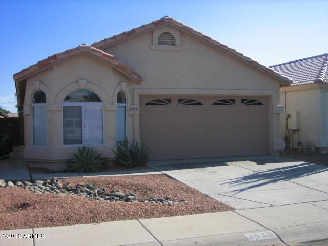 4533 E Glenhaven Dr, Phoenix, AZ 85048 - mediterranean / spanish house featuring an attached garage, driveway, a tile roof, and stucco siding