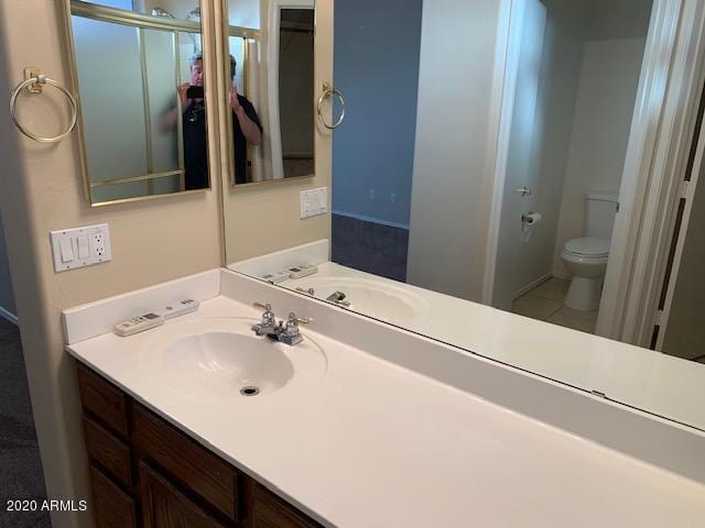 4533 E Glenhaven Dr, Phoenix, AZ 85048 - bathroom featuring toilet and vanity