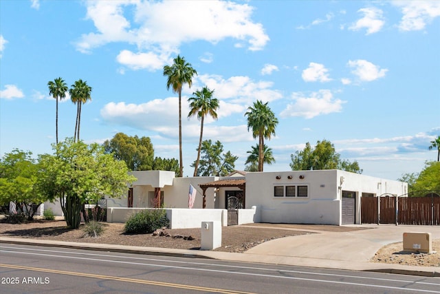 14401 N Coral Gables Dr, Phoenix, AZ 85023 - view of front of house featuring a garage, stucco siding, a gate, concrete driveway, and a fenced front yard