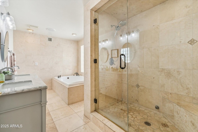 14401 N Coral Gables Dr, Phoenix, AZ 85023 - full bath featuring a garden tub, visible vents, a stall shower, a sink, and tile patterned floors
