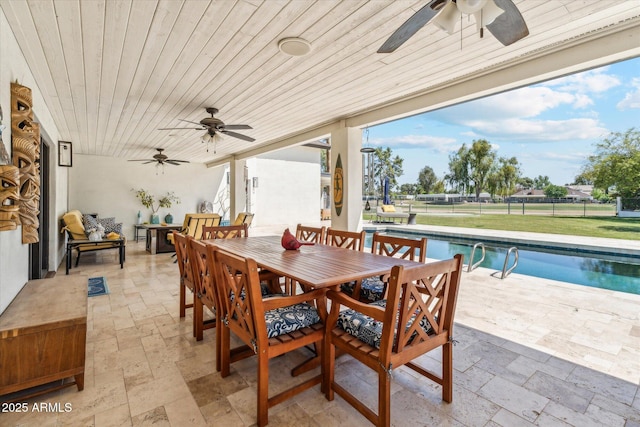 14401 N Coral Gables Dr, Phoenix, AZ 85023 - view of patio with ceiling fan, an outdoor pool, fence, and outdoor dining space