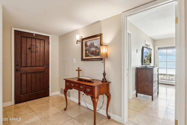 14401 N Coral Gables Dr, Phoenix, AZ 85023 - entryway featuring baseboards, light tile patterned flooring, and visible vents