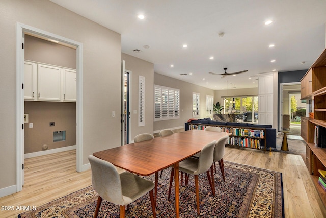 dining area with ceiling fan, plenty of natural light, and light hardwood / wood-style floors