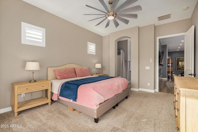 bedroom featuring ceiling fan and carpet