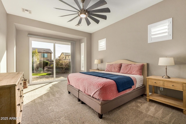 bedroom featuring ceiling fan, access to exterior, and carpet