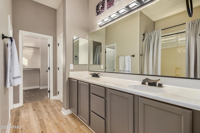 bathroom with vanity, hardwood / wood-style floors, and curtained shower