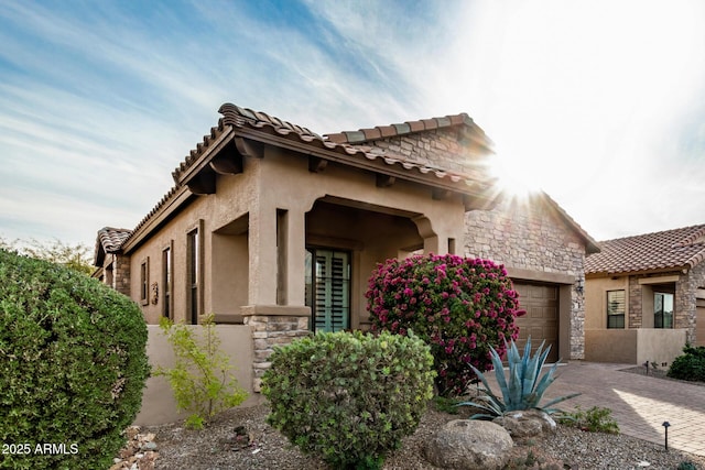 view of side of property featuring a garage