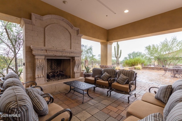 view of patio / terrace featuring exterior fireplace