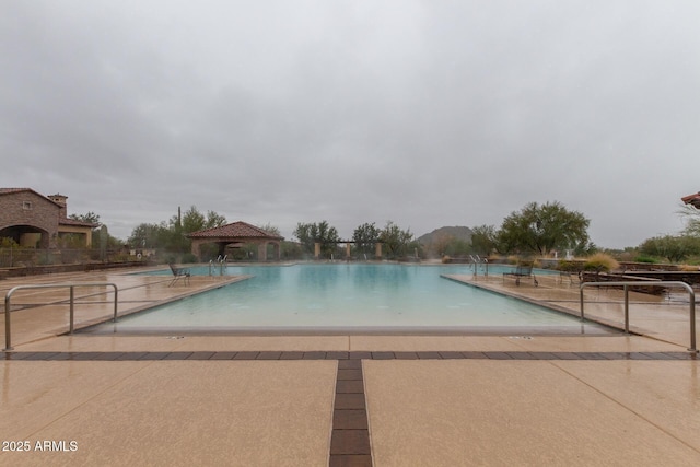 view of pool with a gazebo and a patio