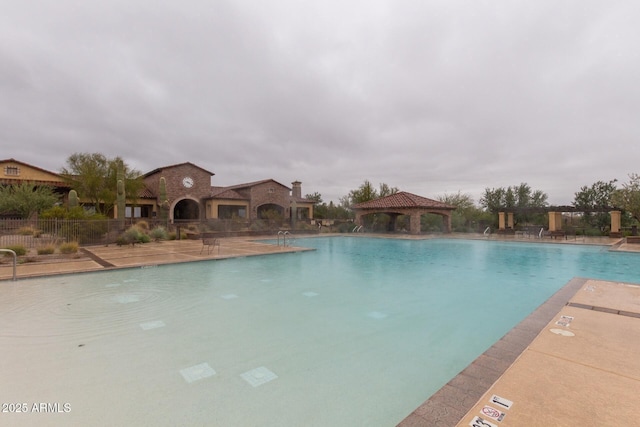 view of pool featuring a gazebo and a patio