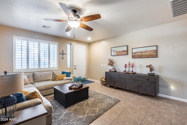 tiled living room featuring ceiling fan