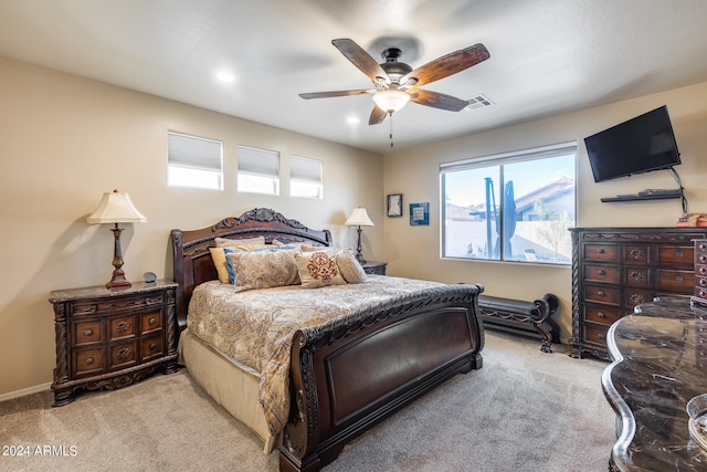 carpeted bedroom with ceiling fan