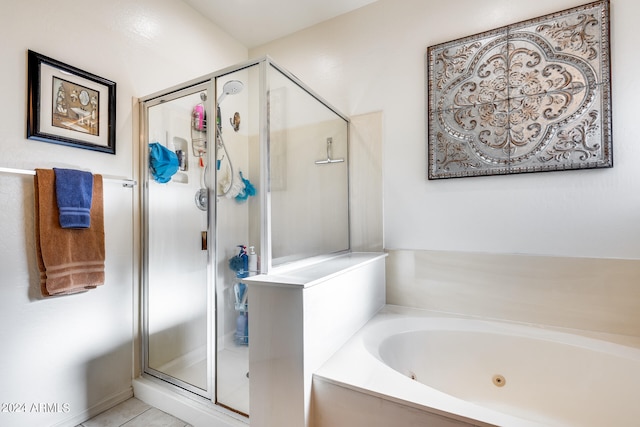 bathroom featuring independent shower and bath and tile patterned flooring