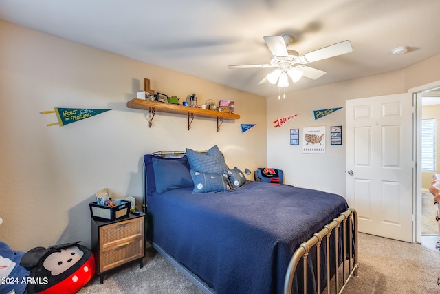 bedroom with ceiling fan and carpet floors