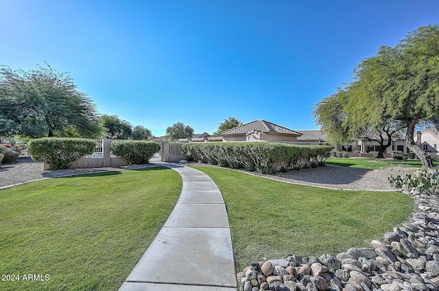 view of home's community featuring a lawn