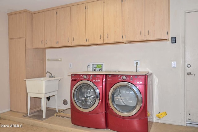 laundry room with cabinets and separate washer and dryer