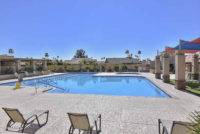 view of swimming pool featuring a patio area