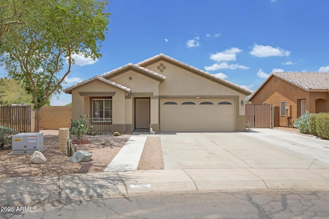 3586 S Moccasin Trl, Gilbert, AZ 85297 - mediterranean / spanish-style home featuring stucco siding, a garage, driveway, a tile roof, and a gate