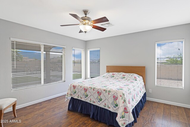 3586 S Moccasin Trl, Gilbert, AZ 85297 - bedroom with baseboards, hardwood / wood-style flooring, and ceiling fan