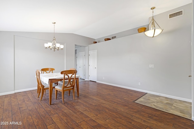 3586 S Moccasin Trl, Gilbert, AZ 85297 - dining area featuring lofted ceiling, a chandelier, dark wood finished floors, and baseboards