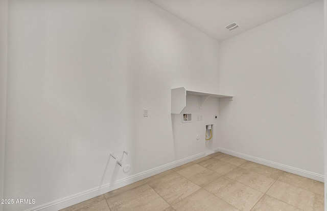 laundry area with laundry area, baseboards, gas dryer hookup, and electric dryer hookup