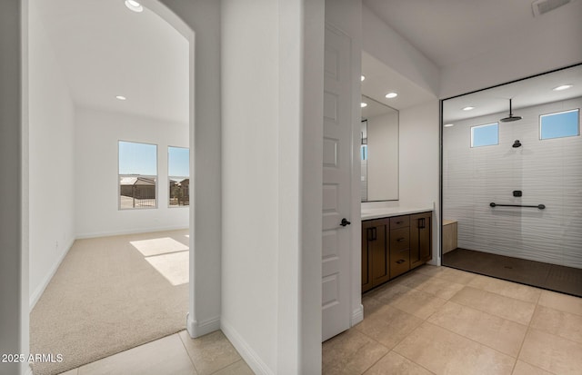 full bathroom featuring baseboards, walk in shower, vanity, and recessed lighting