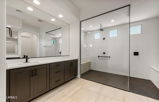 full bath featuring recessed lighting, visible vents, walk in shower, and vanity