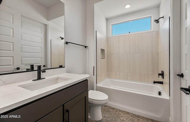 full bath featuring tub / shower combination, vanity, and toilet