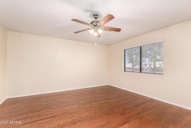 937 N Marble St, Gilbert, AZ 85234 - unfurnished room with a ceiling fan, wood finished floors, and baseboards
