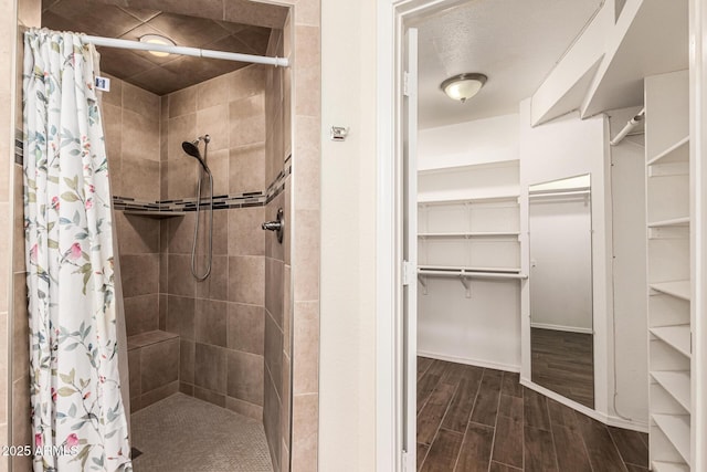 937 N Marble St, Gilbert, AZ 85234 - full bath with a stall shower, a walk in closet, wood finished floors, and baseboards