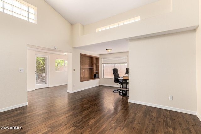 937 N Marble St, Gilbert, AZ 85234 - unfurnished office featuring dark wood-style floors, baseboards, and a towering ceiling