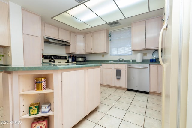 1565 E 12th St, Douglas, AZ 85607 - kitchen with dishwasher, under cabinet range hood, stove, open shelves, and cream cabinetry
