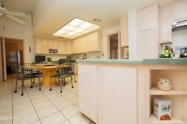 1565 E 12th St, Douglas, AZ 85607 - kitchen with under cabinet range hood, ceiling fan, light tile patterned flooring, and an office area