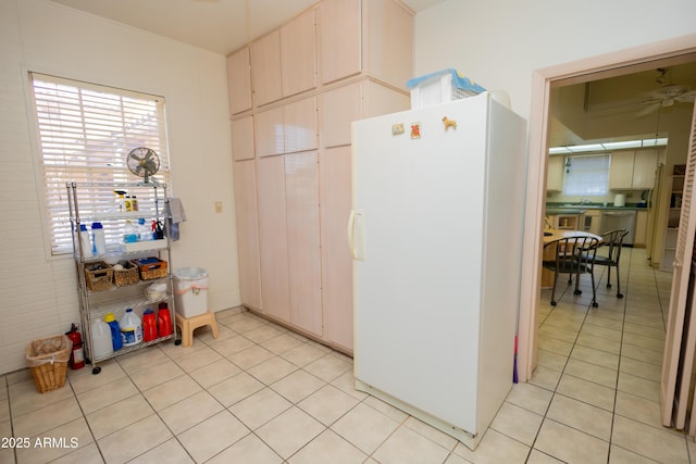1565 E 12th St, Douglas, AZ 85607 - kitchen featuring freestanding refrigerator, dishwasher, light tile patterned floors, and a ceiling fan