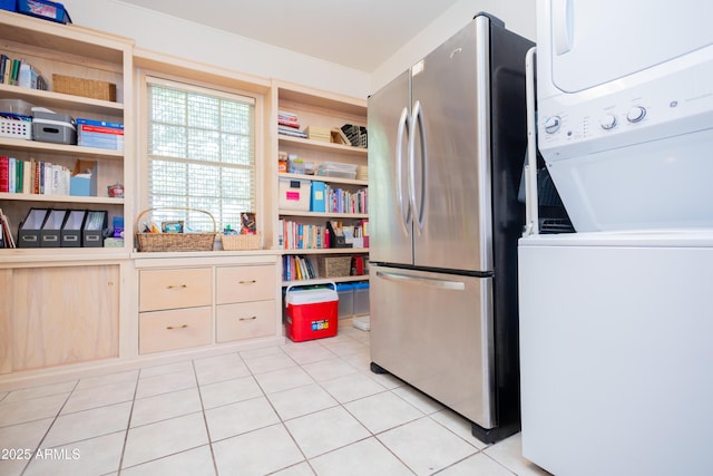 1565 E 12th St, Douglas, AZ 85607 - kitchen featuring freestanding refrigerator, open shelves, stacked washer / dryer, light tile patterned floors, and light countertops
