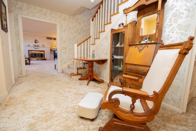 1565 E 12th St, Douglas, AZ 85607 - sitting room with wallpapered walls, carpet floors, stairway, and a tiled fireplace