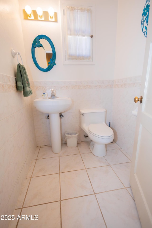 1565 E 12th St, Douglas, AZ 85607 - half bath featuring wainscoting, tile walls, and tile patterned floors